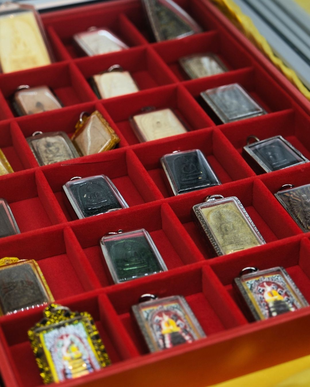 Sacred amulets in collection trays